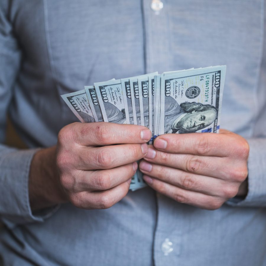 Businessman holding money in his hands Businessman holding money in his hands